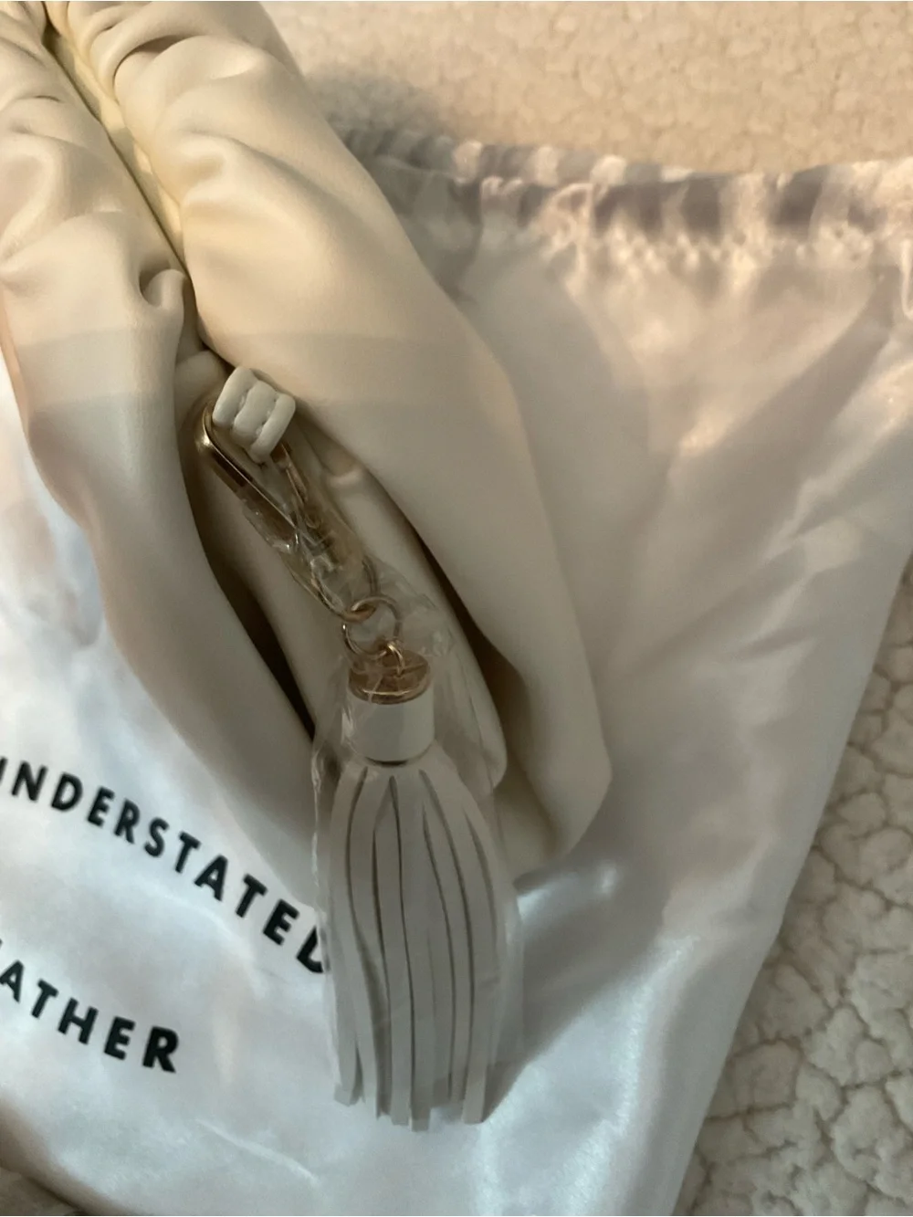 Understated Leather crescent cream